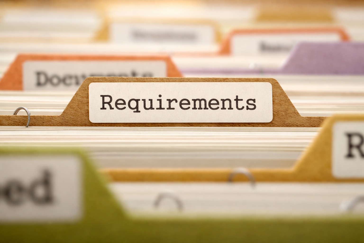 Folder tab labelled requirements, evoking specs treated as frozen rather than negotiable